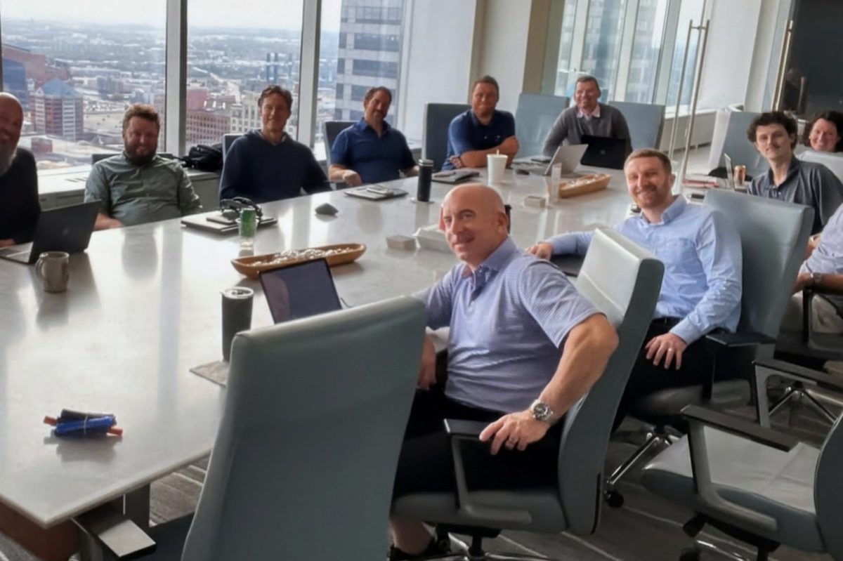 Flaherty & Collins executives in a boardroom overlooking downtown Indianapolis